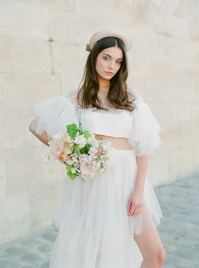 Fashionable bride with large straw hat lace cover up on yacht - Greg Finck  Photography